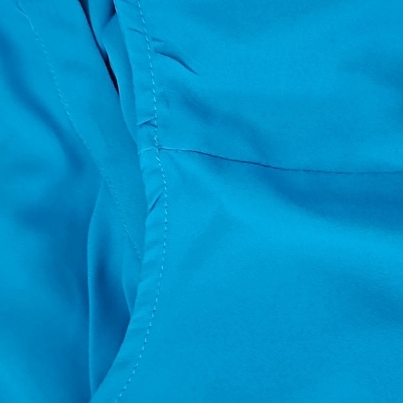 Elle Turquoise Sleeveless Blouse with Ruffles and Pleated Front - Picture 12 of 15